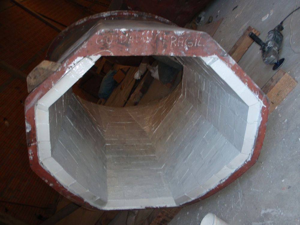 Interior of rectangular duct lined with wear-resistant ceramic