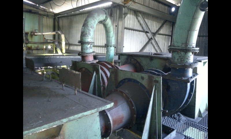 Wear-resistant ceramic-lined piping installed in an industrial plant